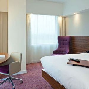 Hotel room with TV and workspace at Hampton By Hilton London Gatwick Airport.