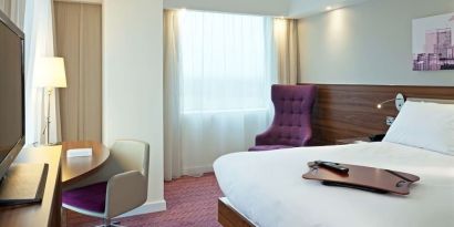 Hotel room with TV and workspace at Hampton By Hilton London Gatwick Airport.