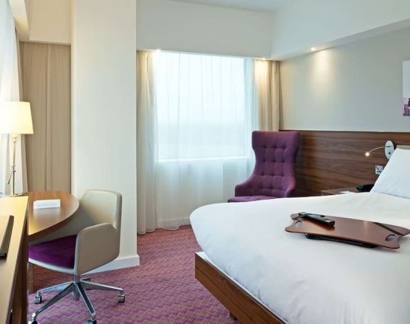 Hotel room with TV and workspace at Hampton By Hilton London Gatwick Airport.