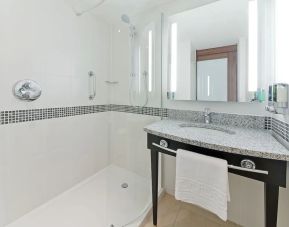 Private bathroom with shower and bath at Hampton By Hilton London Gatwick Airport.