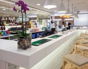 Coworking space and bar at Hampton By Hilton London Gatwick Airport.