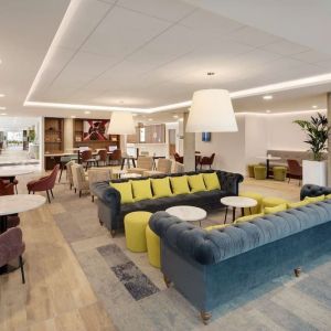 Coworking space and lounge at Hampton By Hilton London Stansted Airport.