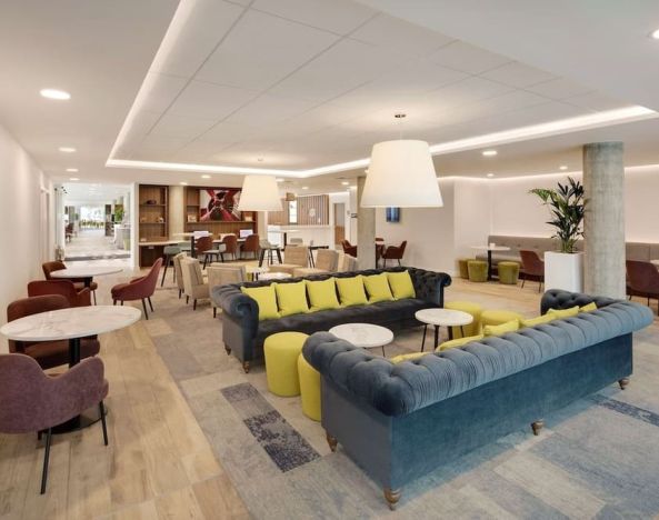 Coworking space and lounge at Hampton By Hilton London Stansted Airport.