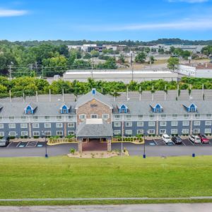 Hotel exterior by day at Comfort Inn & Suites Nashville.