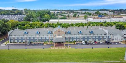 Hotel exterior by day at Comfort Inn & Suites Nashville.