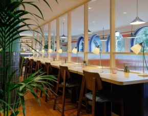 Dining area perfect for coworking at Hilton Cobham.