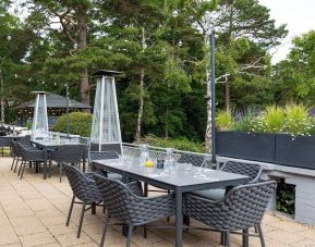 Outdoor dining area at Hilton Cobham.