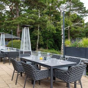 Outdoor dining area at Hilton Cobham.