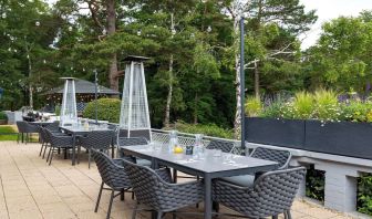 Outdoor dining area at Hilton Cobham.