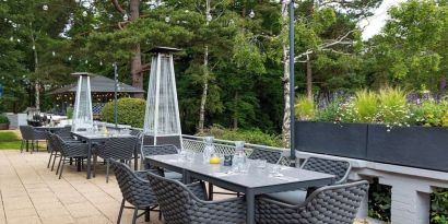 Outdoor dining area at Hilton Cobham.