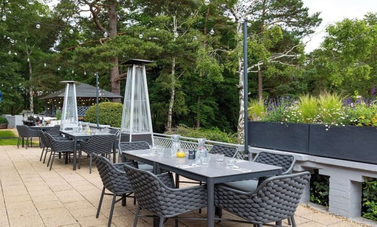 Outdoor dining area at Hilton Cobham.