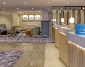 Lobby and coworking lounge at Hilton Cobham.