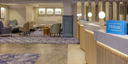 Lobby and coworking lounge at Hilton Cobham.