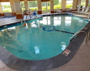 Indoor pool with natural light at Baymont By Wyndham Pella.