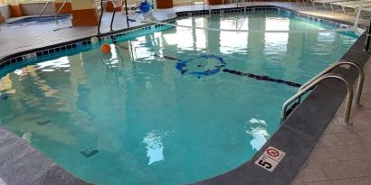 Indoor pool with natural light at Baymont By Wyndham Pella.