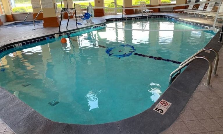 Indoor pool with natural light at Baymont By Wyndham Pella.