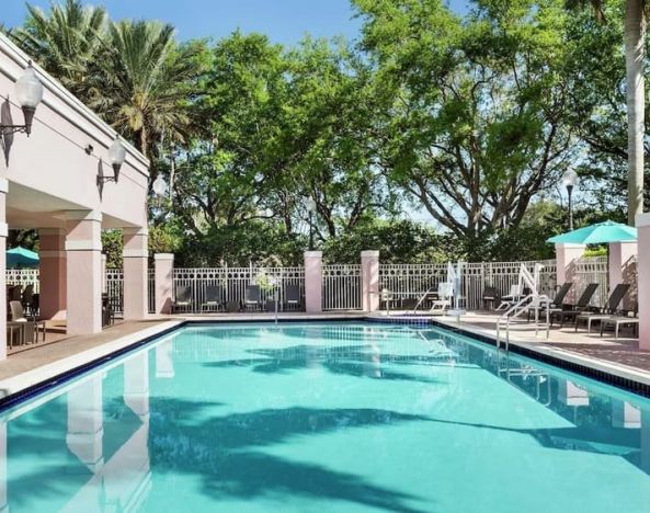 Refreshing outdoor pool at DoubleTree By Hilton Sunrise.