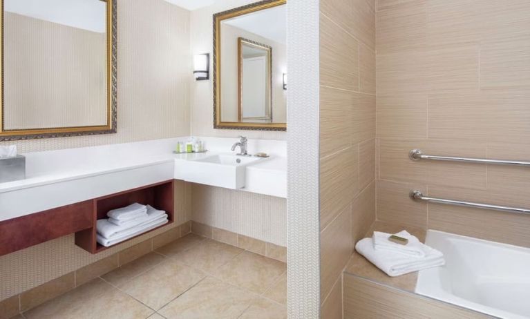 Guest bathroom with tub at DoubleTree By Hilton Sunrise.