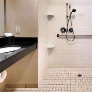 Guest bathroom with shower at Fairfield Inn & Suites By Marriott Tallahassee Central.