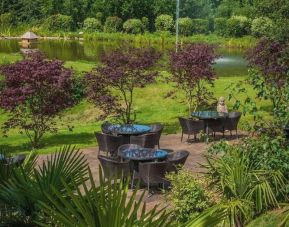 Outdoor seating and natural scenery at DoubleTree By Hilton Bristol South - Cadbury House.