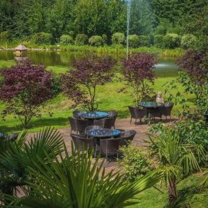 Outdoor seating and natural scenery at DoubleTree By Hilton Bristol South - Cadbury House.