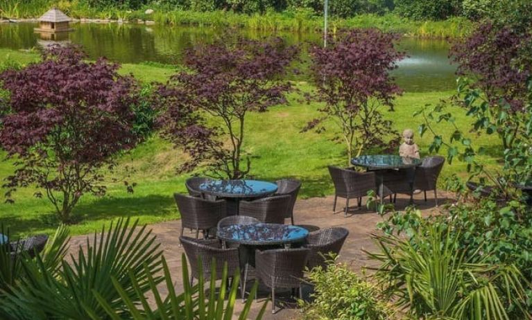 Outdoor seating and natural scenery at DoubleTree By Hilton Bristol South - Cadbury House.