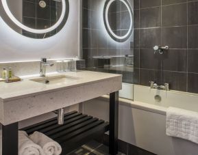 Guest bathroom with shower and tub at DoubleTree By Hilton Bristol South - Cadbury House.