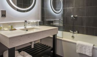 Guest bathroom with shower and tub at DoubleTree By Hilton Bristol South - Cadbury House.