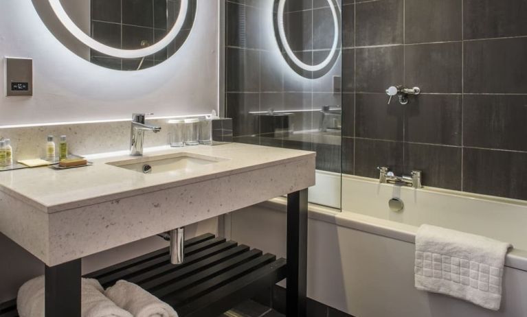 Guest bathroom with shower and tub at DoubleTree By Hilton Bristol South - Cadbury House.