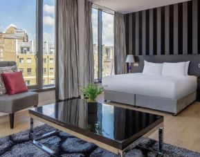 Spacious king suite with city views at DoubleTree by Hilton London Greenwich.