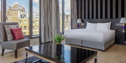 Spacious king suite with city views at DoubleTree by Hilton London Greenwich.