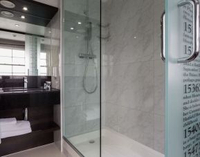 Guest bathroom with shower at DoubleTree by Hilton London Greenwich.