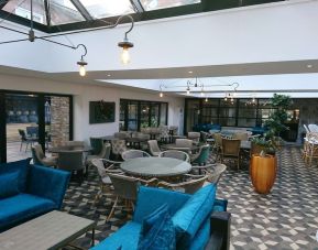 Spacious dining area with natural light at DoubleTree By Hilton York.