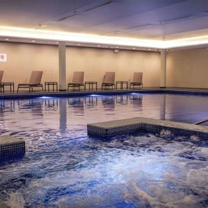 Refreshing indoor pool at Lincoln Plaza London, Curio Collection By Hilton.