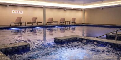 Refreshing indoor pool at Lincoln Plaza London, Curio Collection By Hilton.