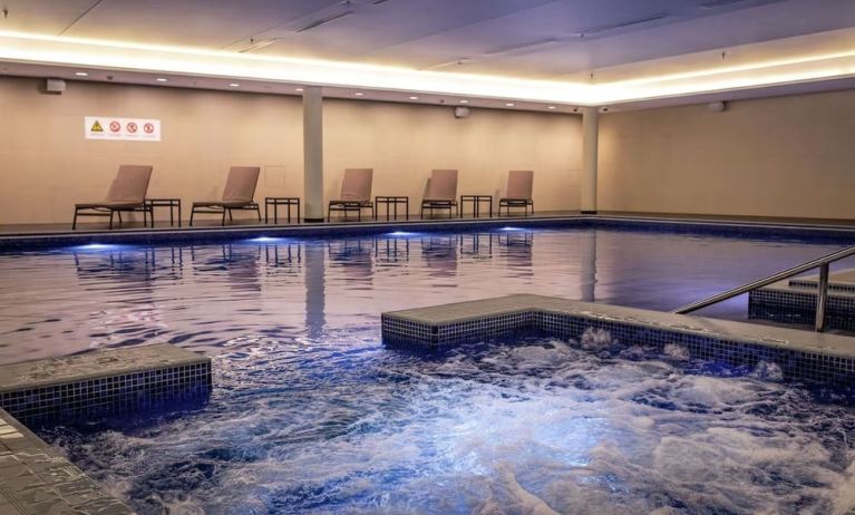 Refreshing indoor pool at Lincoln Plaza London, Curio Collection By Hilton.