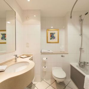 Guest bathroom with shower at Doubletree by Hilton Glasgow Strathclyde. 