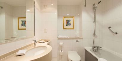 Guest bathroom with shower at Doubletree by Hilton Glasgow Strathclyde. 