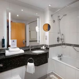 Guest bathroom with shower at DoubleTree by Hilton Swindon.