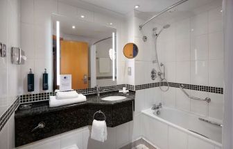 Guest bathroom with shower at DoubleTree by Hilton Swindon.