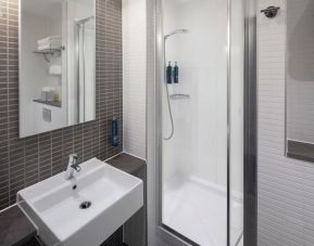 Guest bathroom with shower at DoubleTree By Hilton Leeds City Centre.