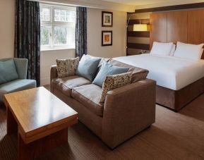 King bed with sofa at DoubleTree By Hilton Stratford-upon-Avon.