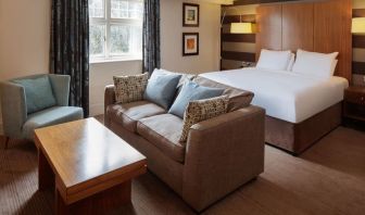 King bed with sofa at DoubleTree By Hilton Stratford-upon-Avon.