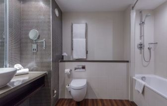 Guest bathroom with shower at DoubleTree By Hilton Stratford-upon-Avon.