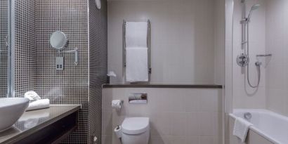 Guest bathroom with shower at DoubleTree By Hilton Stratford-upon-Avon.