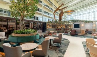 Dining area perfect for coworking  at Hilton London Heathrow Airport.