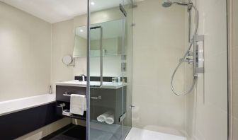 Guest bathroom with shower at Hilton London Heathrow Airport.