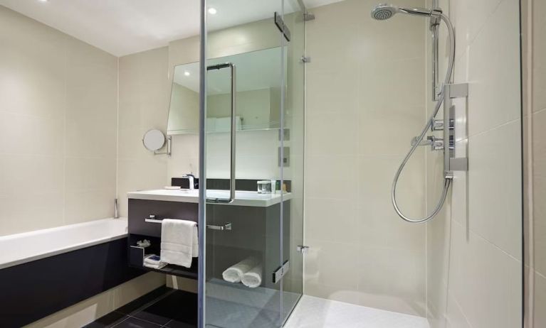 Guest bathroom with shower at Hilton London Heathrow Airport.