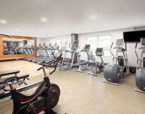 Fully equipped fitness center at Hilton London Heathrow Airport.