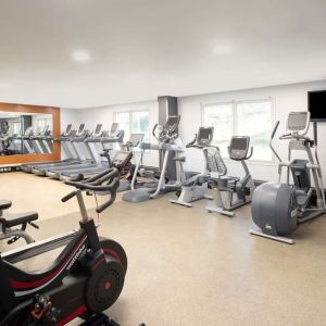 Fully equipped fitness center at Hilton London Heathrow Airport.